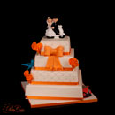 white and orange wedding cake