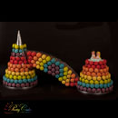 Rainbow macarons wedding cake - love is...